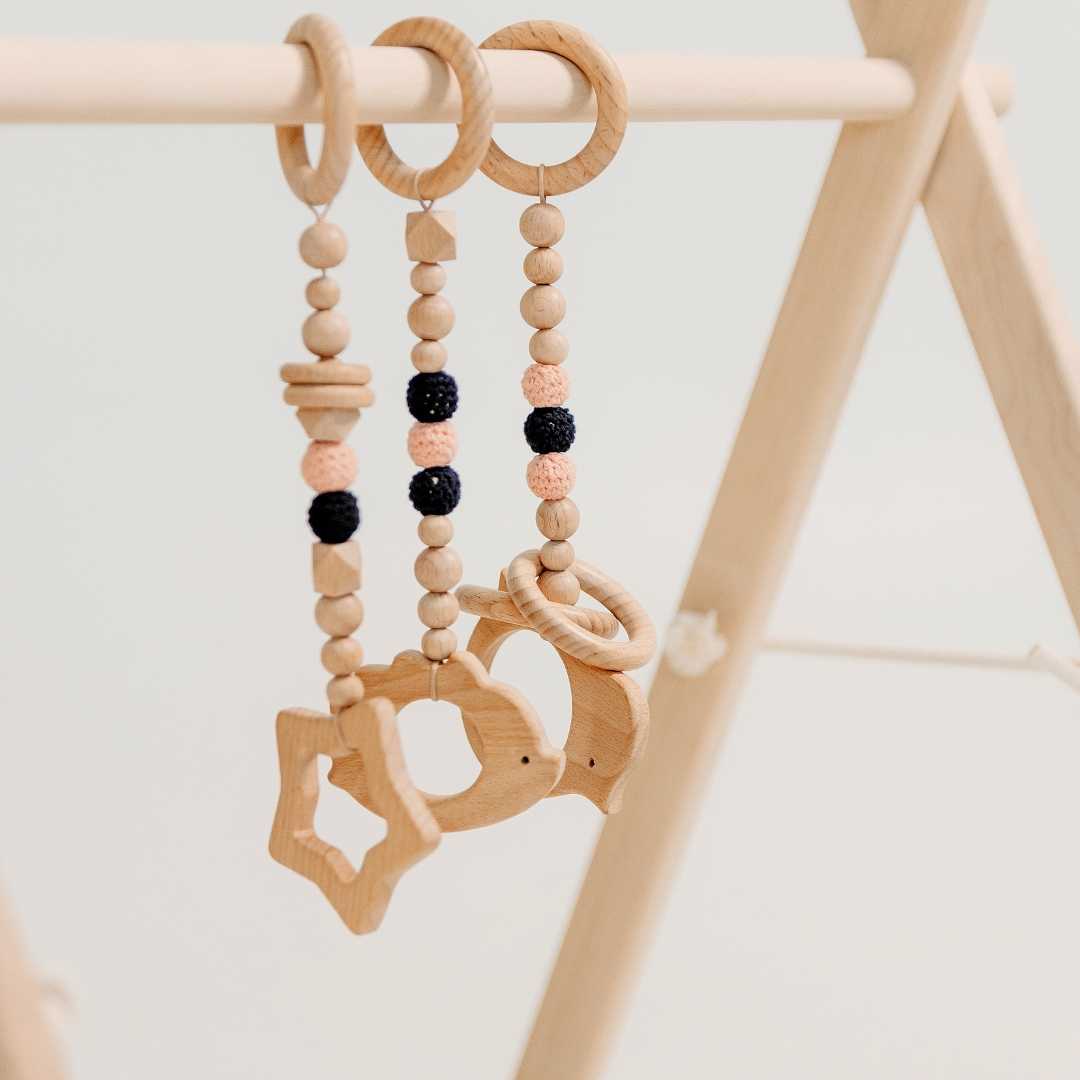 Wooden Baby Gym with Pink Toys – Montessori Play Arch