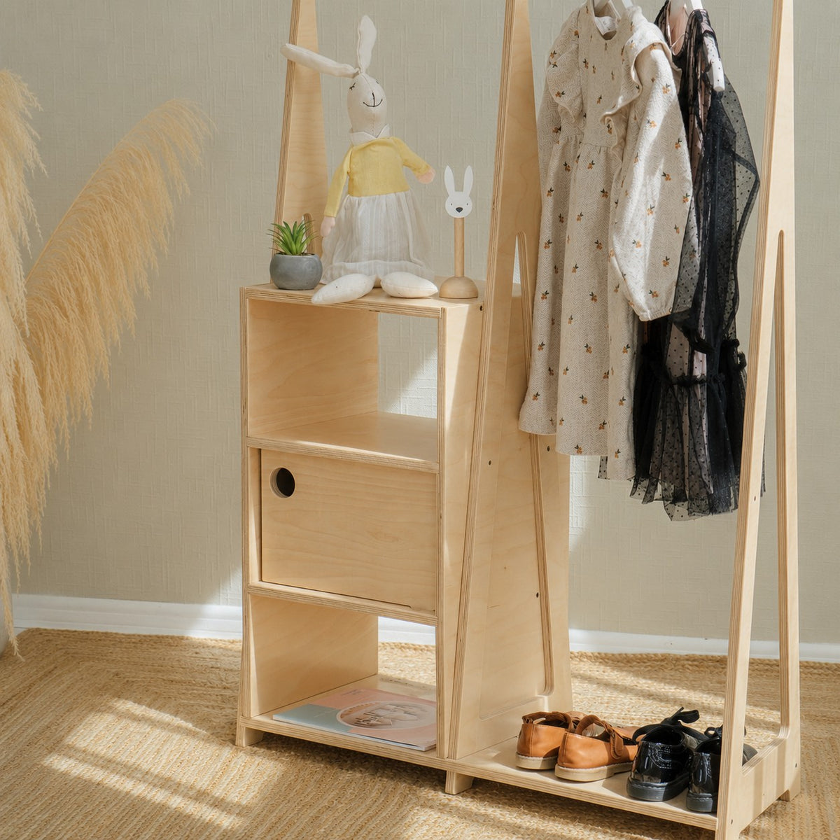 Montessori wardrobe in a child's bedroom, natural birch plywood finish