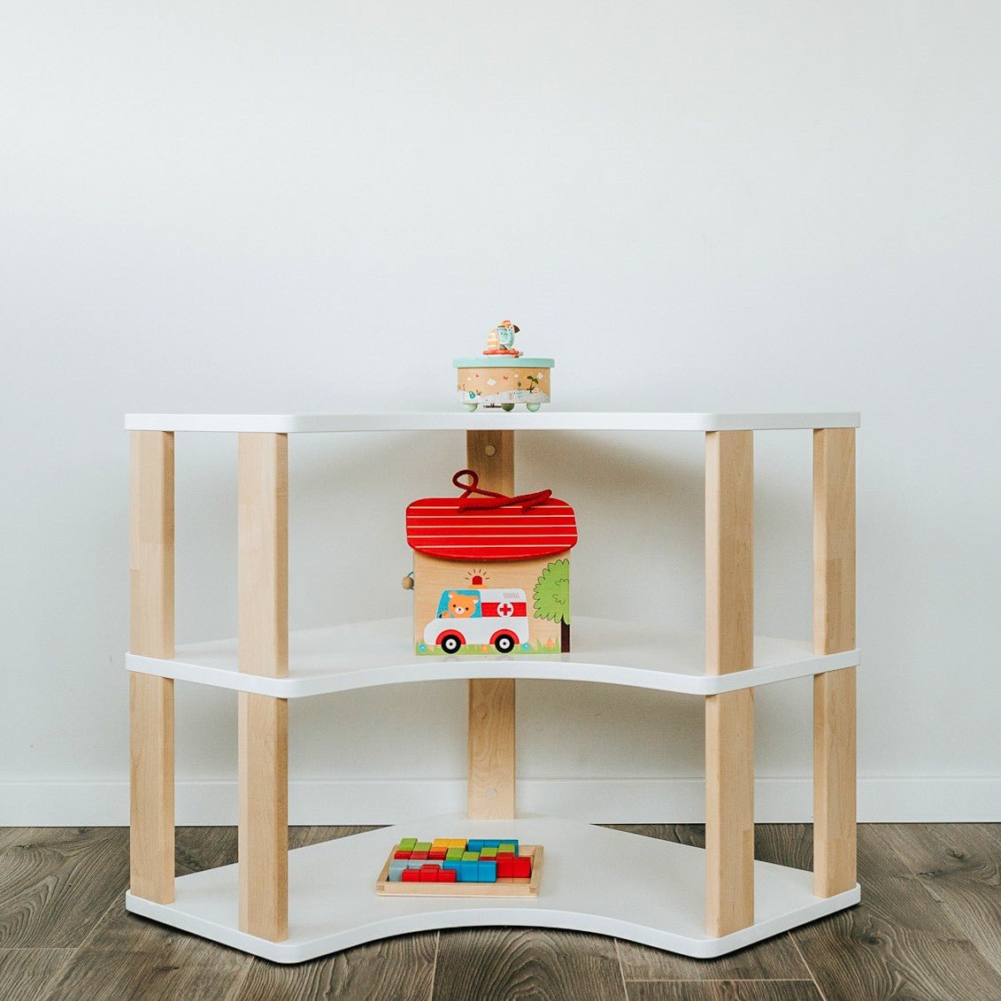 One Little Pine Modular Montessori Shelf Corner, 3 shelves, Natural Wood / Clear Oil / White finishes — solid wood Montessori corner shelving unit for kids' rooms