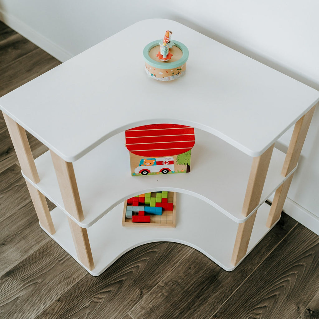 One Little Pine Modular Montessori Shelf Corner, 3 shelves, Natural Wood / Clear Oil / White finishes — solid wood Montessori corner shelving unit for kids' rooms
