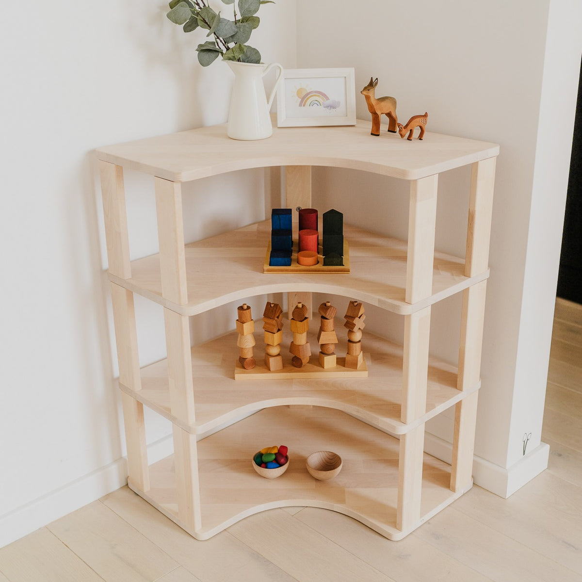 One Little Pine Modular Montessori Shelf Corner, 4 shelves, Natural Wood / Clear Oil / White finishes — solid wood Montessori corner shelving unit for kids' rooms
