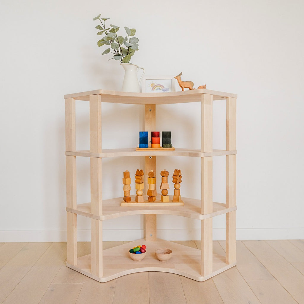 One Little Pine Modular Montessori Shelf Corner, 4 shelves, Natural Wood / Clear Oil / White finishes — solid wood Montessori corner shelving unit for kids' rooms