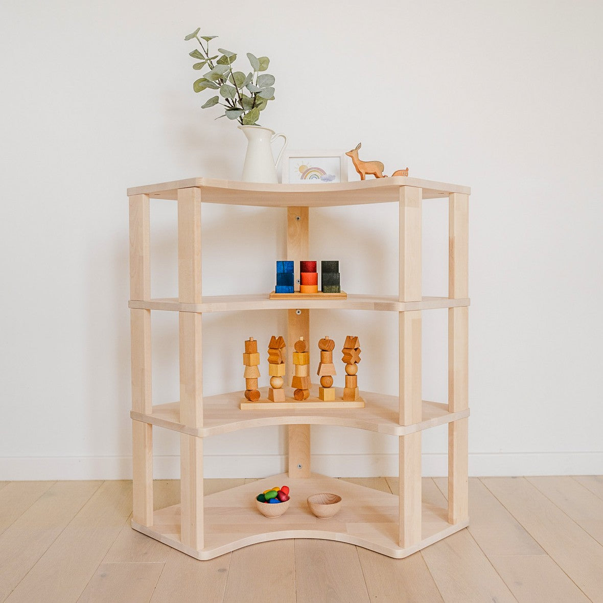One Little Pine Modular Montessori Shelf Corner, 4 shelves, Natural Wood / Clear Oil / White finishes — solid wood Montessori corner shelving unit for kids' rooms