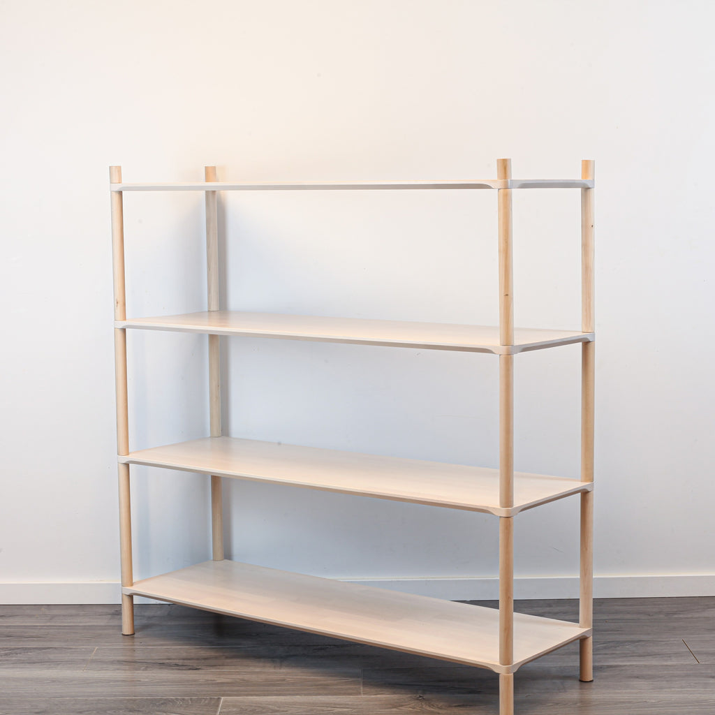 One Little Pine Large 4-Shelf Montessori-Inspired Wooden Shelving Unit shown from an angled view, highlighting the open shelves at child height.