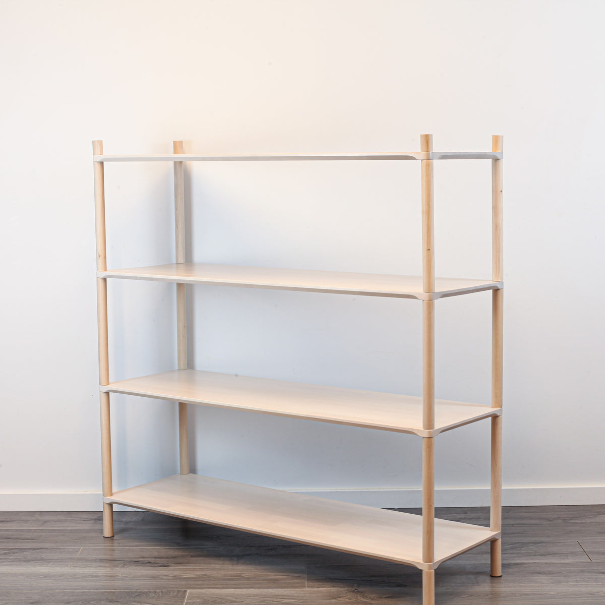 One Little Pine Large 4-Shelf Montessori-Inspired Wooden Shelving Unit shown from an angled view, highlighting the open shelves at child height.