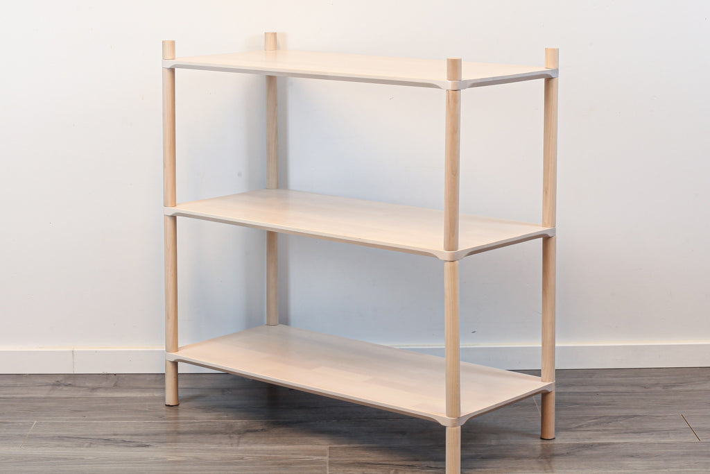 One Little Pine Medium 3-Shelf Montessori-Inspired Wooden Shelving Unit shown from an angled view, highlighting the open shelves at child height.