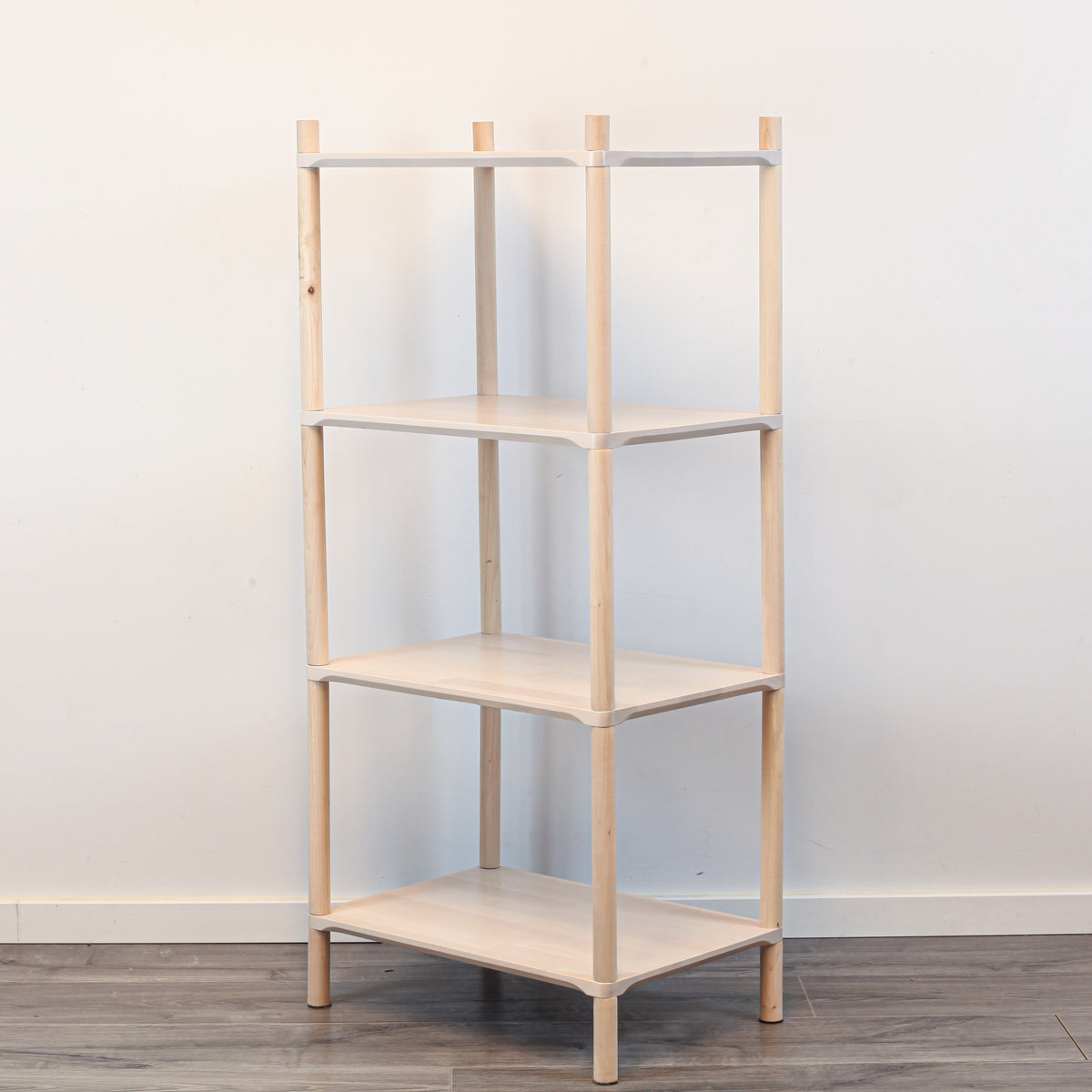 One Little Pine Small 4-Shelf Montessori-Inspired Wooden Shelving Unit shown from an angled view, highlighting the open shelves at child height.