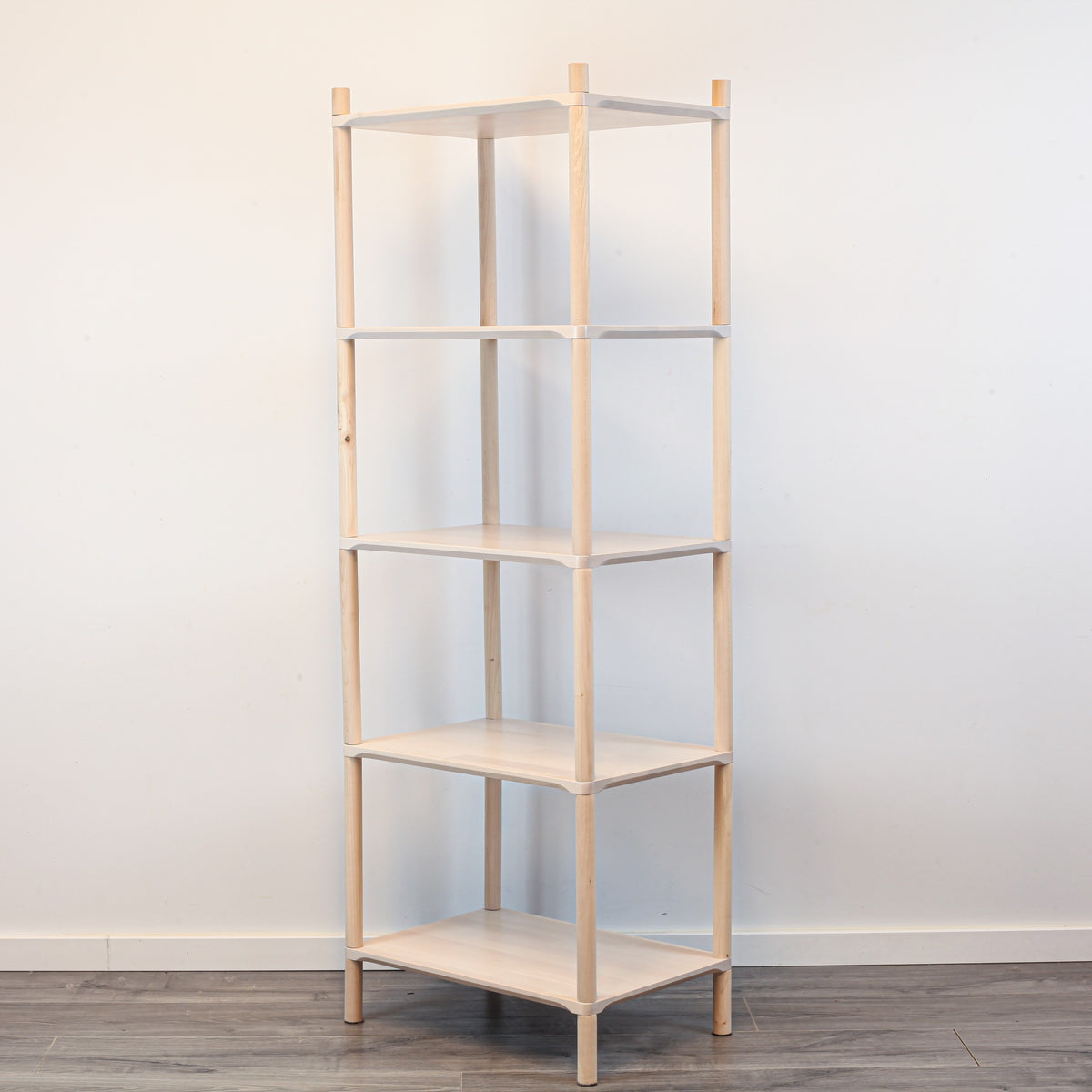 One Little Pine Small 5-Shelf Montessori-Inspired Wooden Shelving Unit shown from an angled view, highlighting the open shelves at child height.
